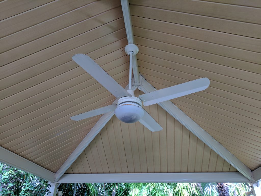 white ceiling fan showing signs of water ingress and corrosion