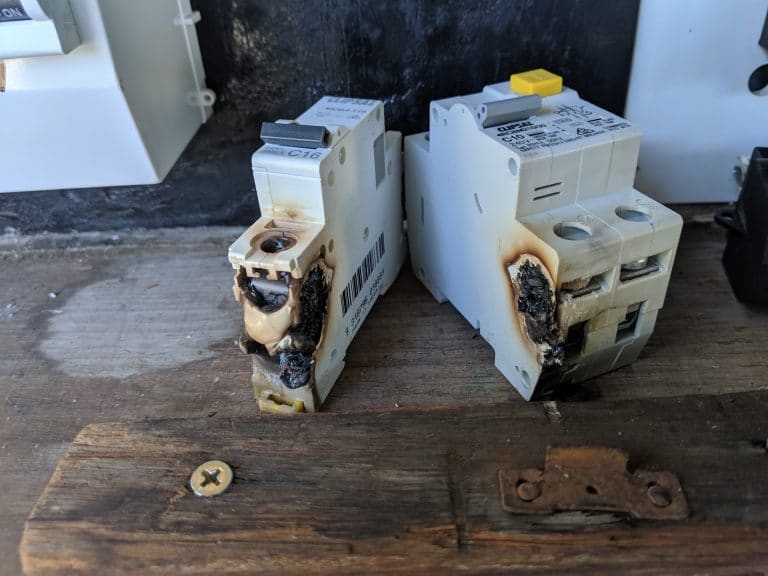 two circuit breakers that had caught fire and melted